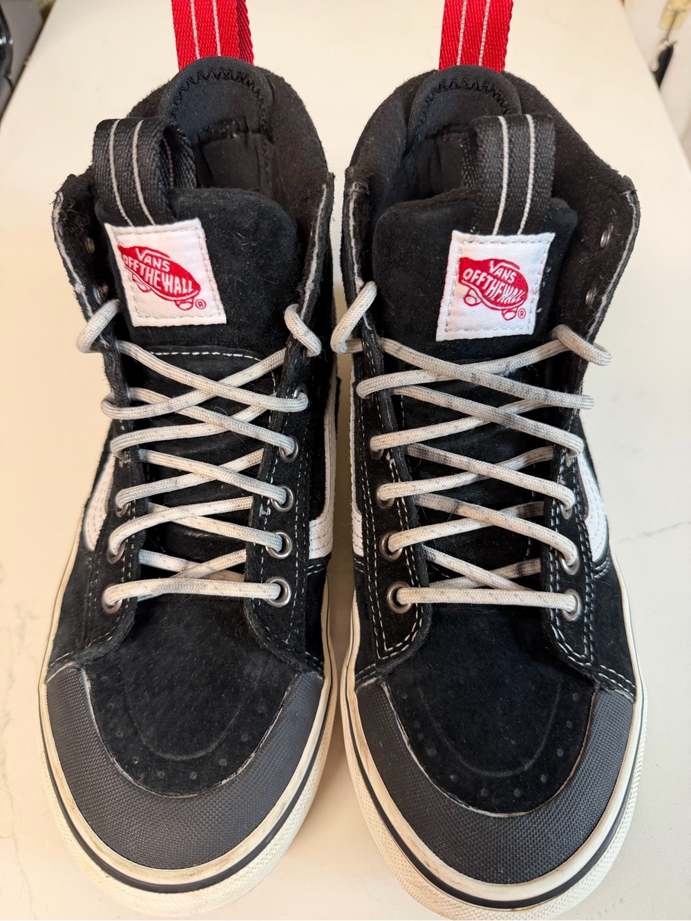 Vans Kids Black and White High-Top Skate Sneakers.